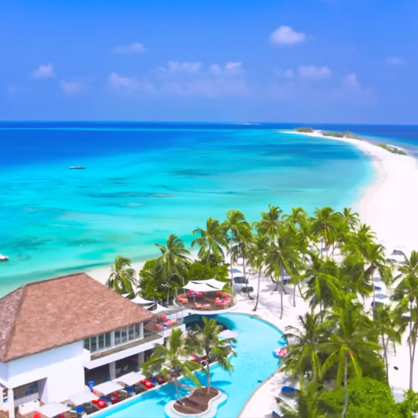 A serene Maldivian resort at sunset